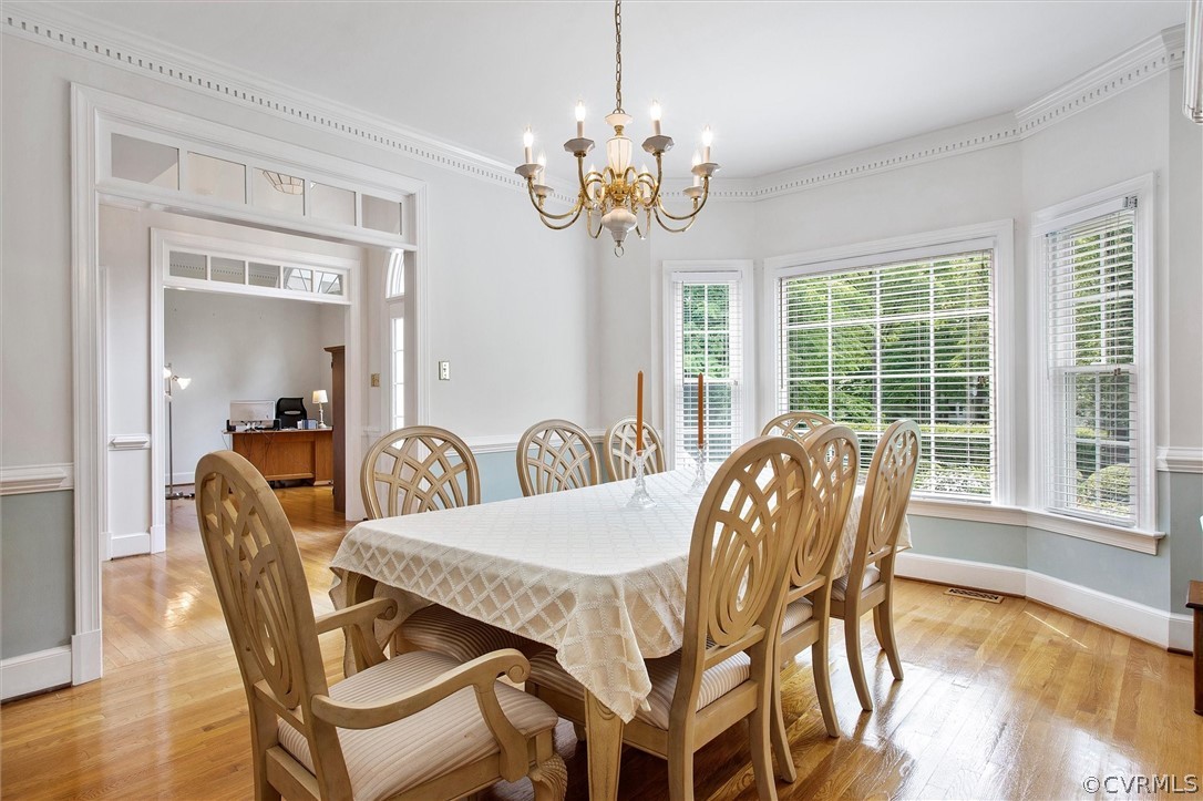 14200 Leafield Drive Midlothian, VA 23113 - Photo 18 of 48 a dining room with furniture a large window and wooden floor