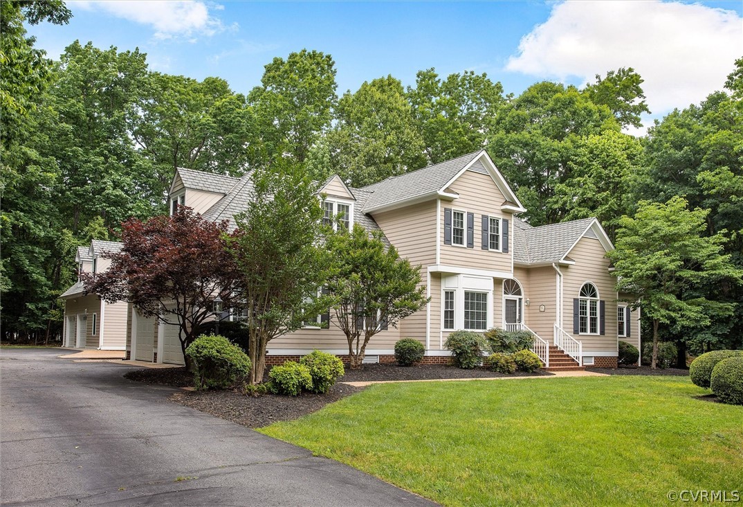 14200 Leafield Drive Midlothian, VA 23113 - Photo 2 of 48 a front view of a house with a yard