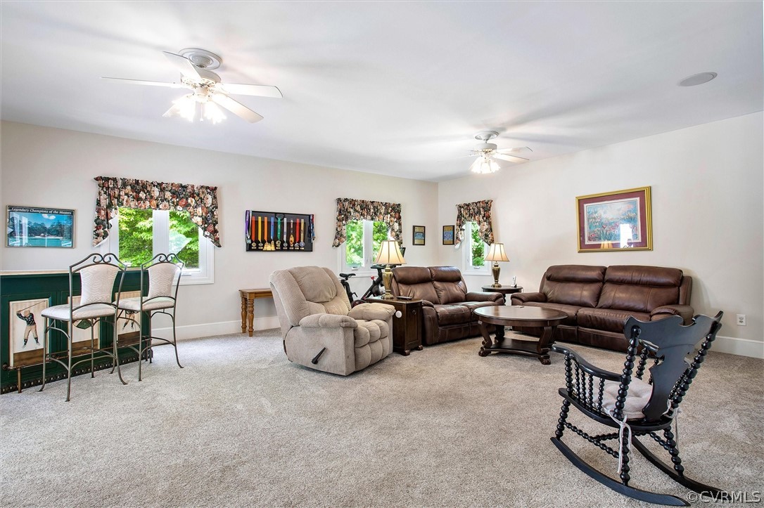 14200 Leafield Drive Midlothian, VA 23113 - Photo 21 of 48 a living room with furniture and a chandelier