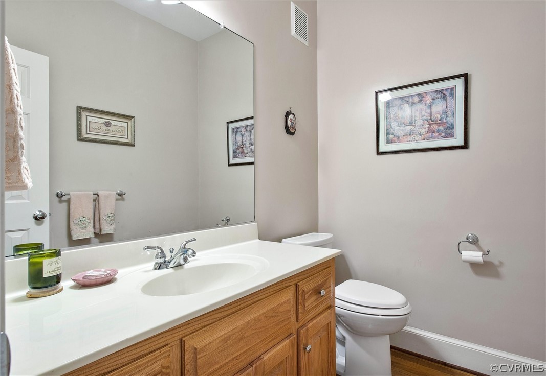 14200 Leafield Drive Midlothian, VA 23113 - Photo 25 of 48 a bathroom with a granite countertop sink mirror vanity and toilet