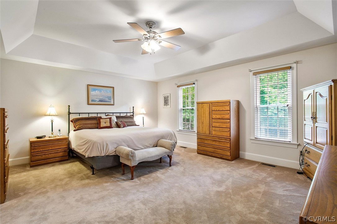 14200 Leafield Drive Midlothian, VA 23113 - Photo 26 of 48 a spacious bedroom with a bed a couch and a chandelier