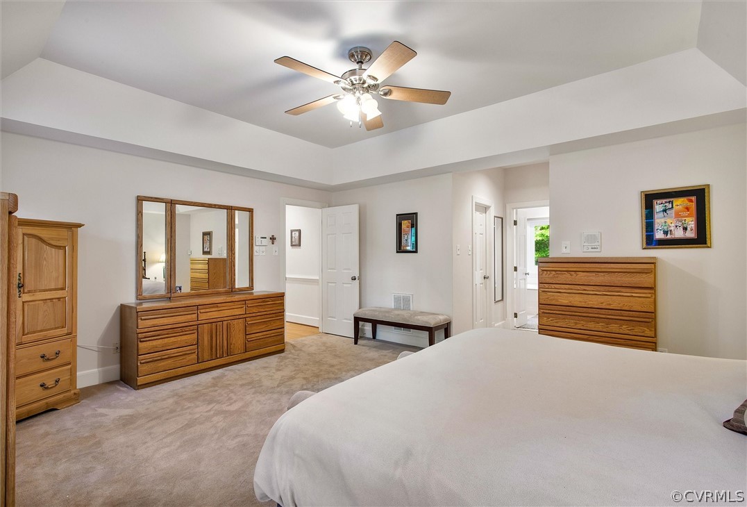 14200 Leafield Drive Midlothian, VA 23113 - Photo 27 of 48 a bedroom with a large bed and a chandelier