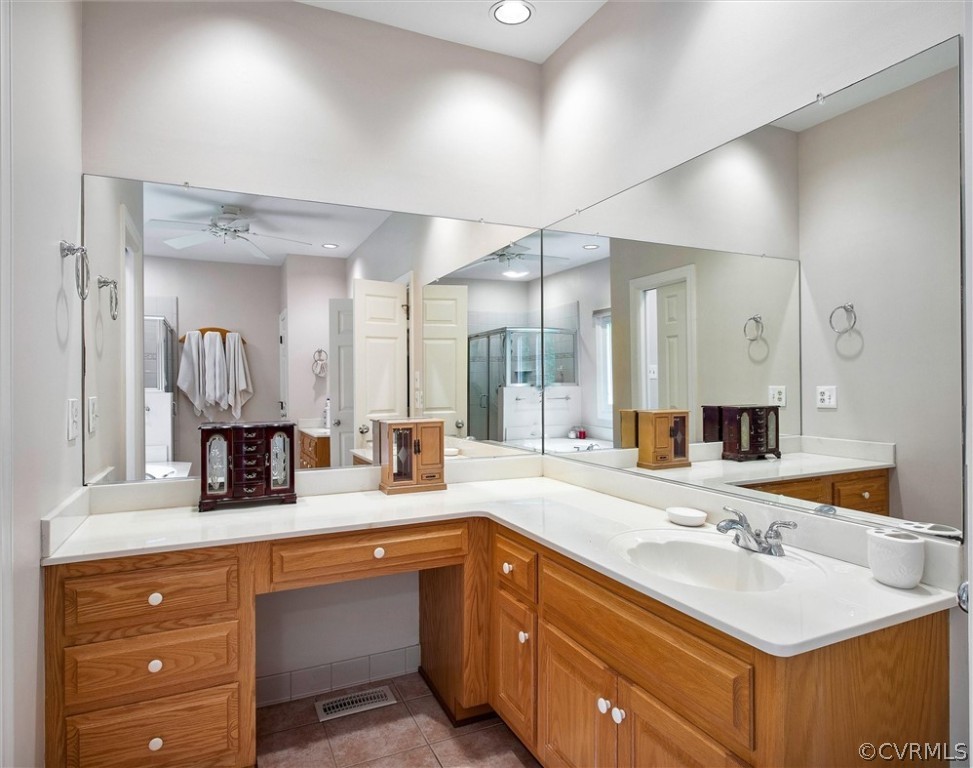 14200 Leafield Drive Midlothian, VA 23113 - Photo 28 of 48 a bathroom with a sink and a large mirror