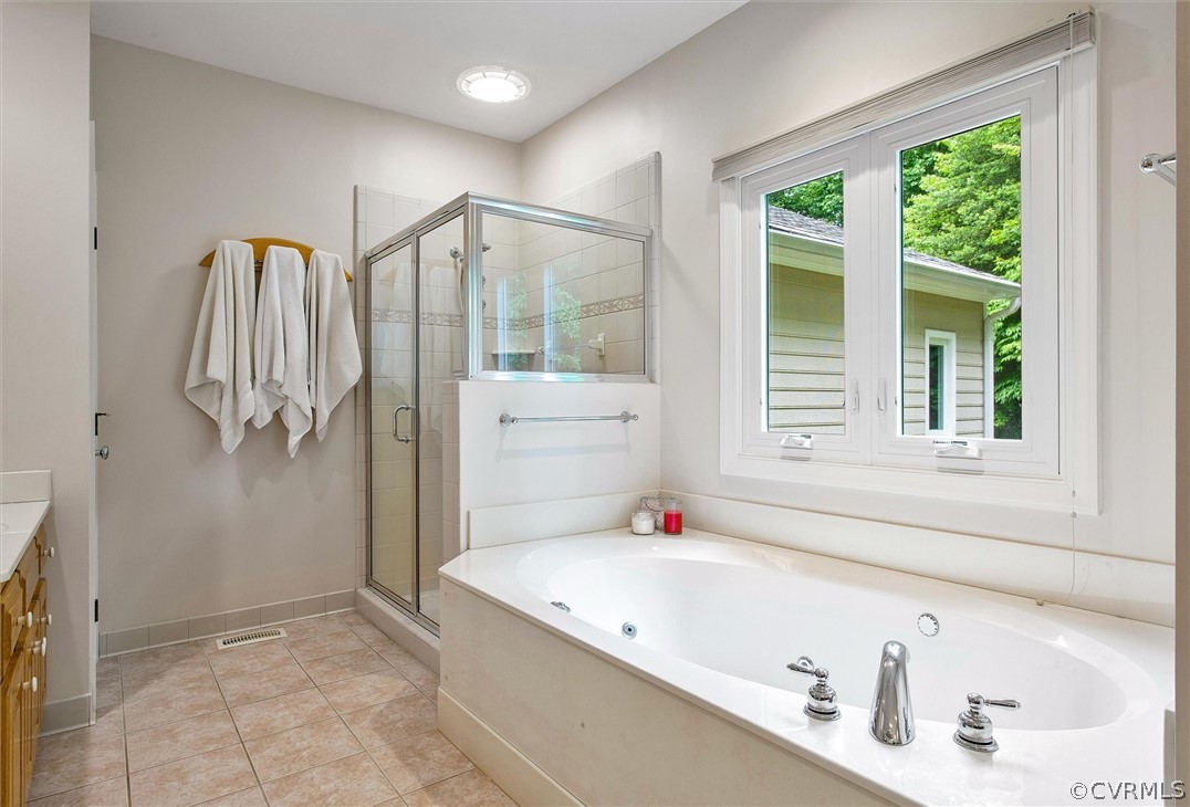 14200 Leafield Drive Midlothian, VA 23113 - Photo 29 of 48 a bathroom with a tub a sink and a window