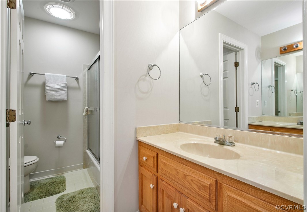 14200 Leafield Drive Midlothian, VA 23113 - Photo 35 of 48 a bathroom with a sink a toilet and shower