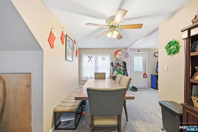 a dining room with furniture and window