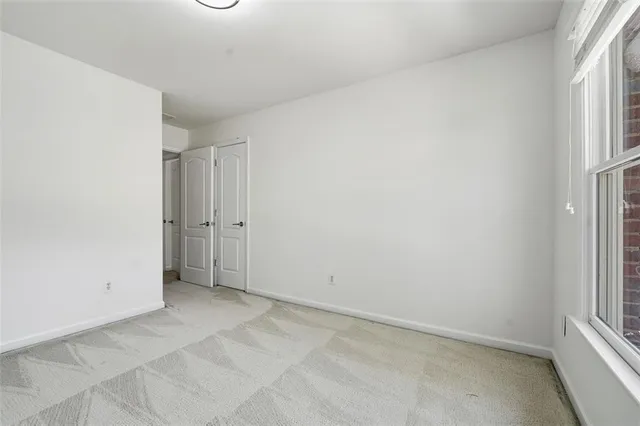 a view of a hallway with stairs