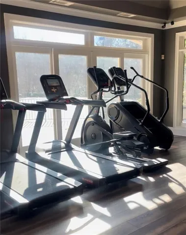 a room with gym equipment and a large window