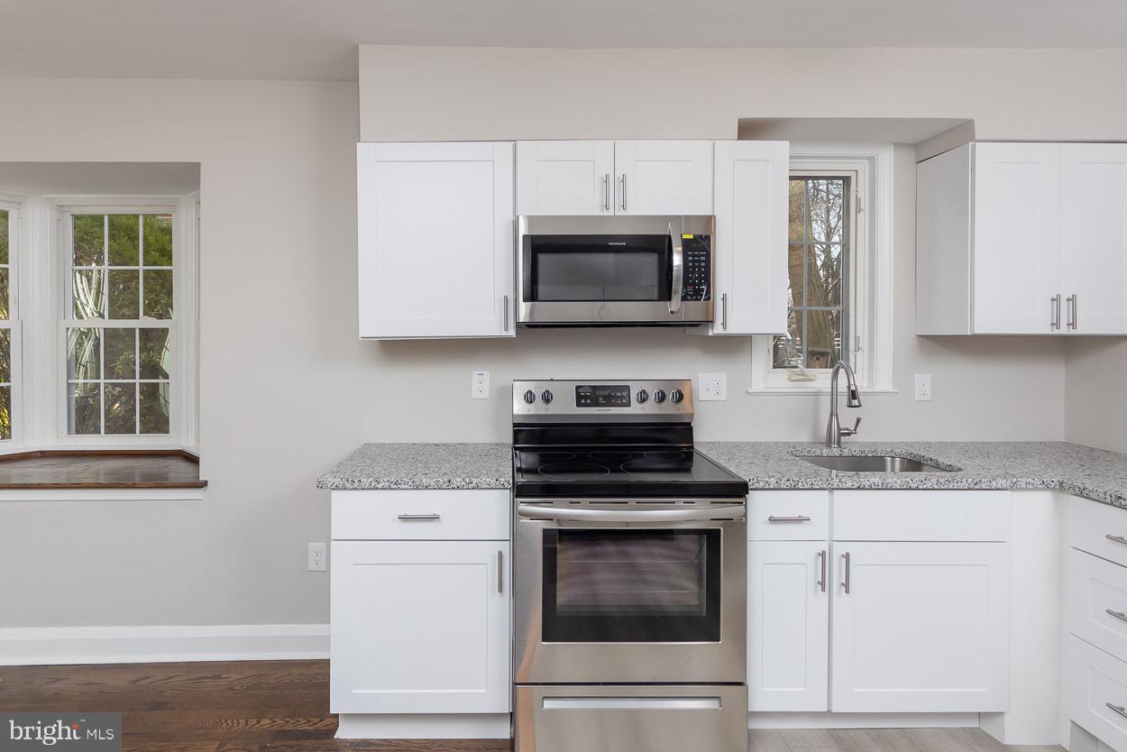 5318 Plymouth Road Baltimore, MD 21214 - Photo 26 of 50 White Shaker Cabinets and Granite Counters