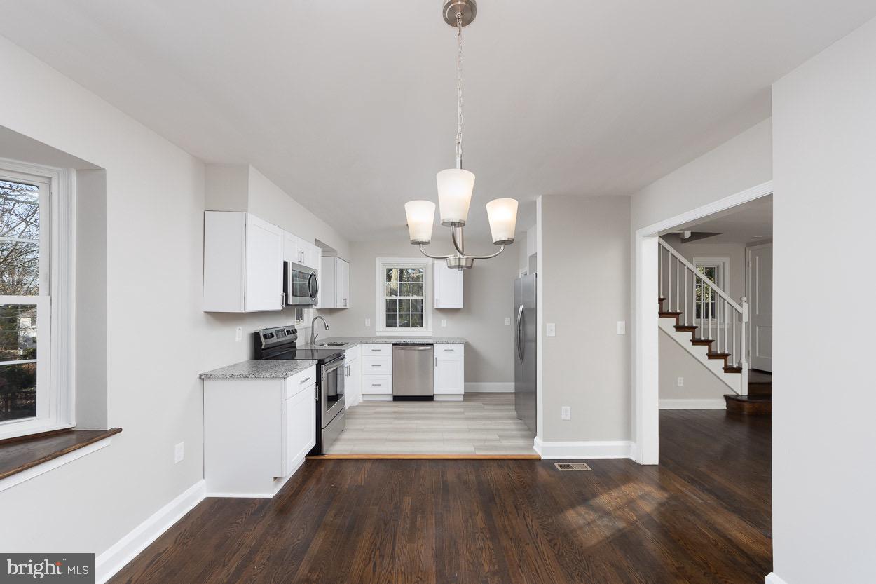 5318 Plymouth Road Baltimore, MD 21214 - Photo 27 of 50 Open Dining Room with Trendy Light Fixture