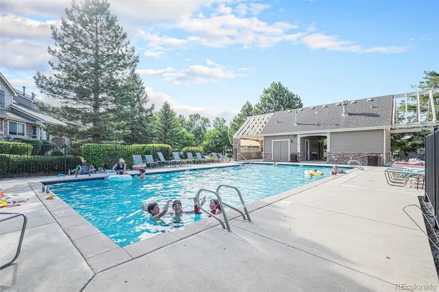 a view of a house with backyard porch and sitting area