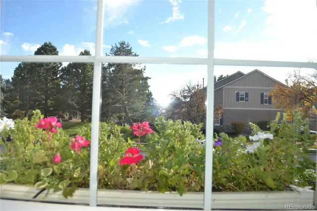 a sign that is in front of flowers