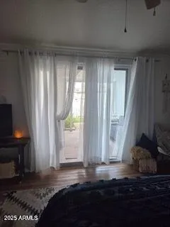 a view of room with window and hardwood floor