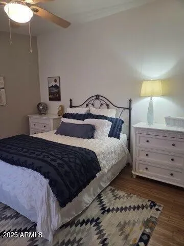 a bedroom with a bed and a night stand