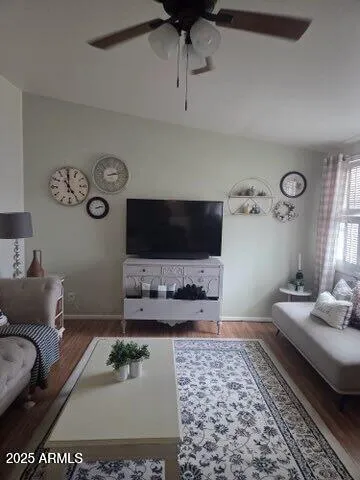 a living room with furniture and a flat screen tv