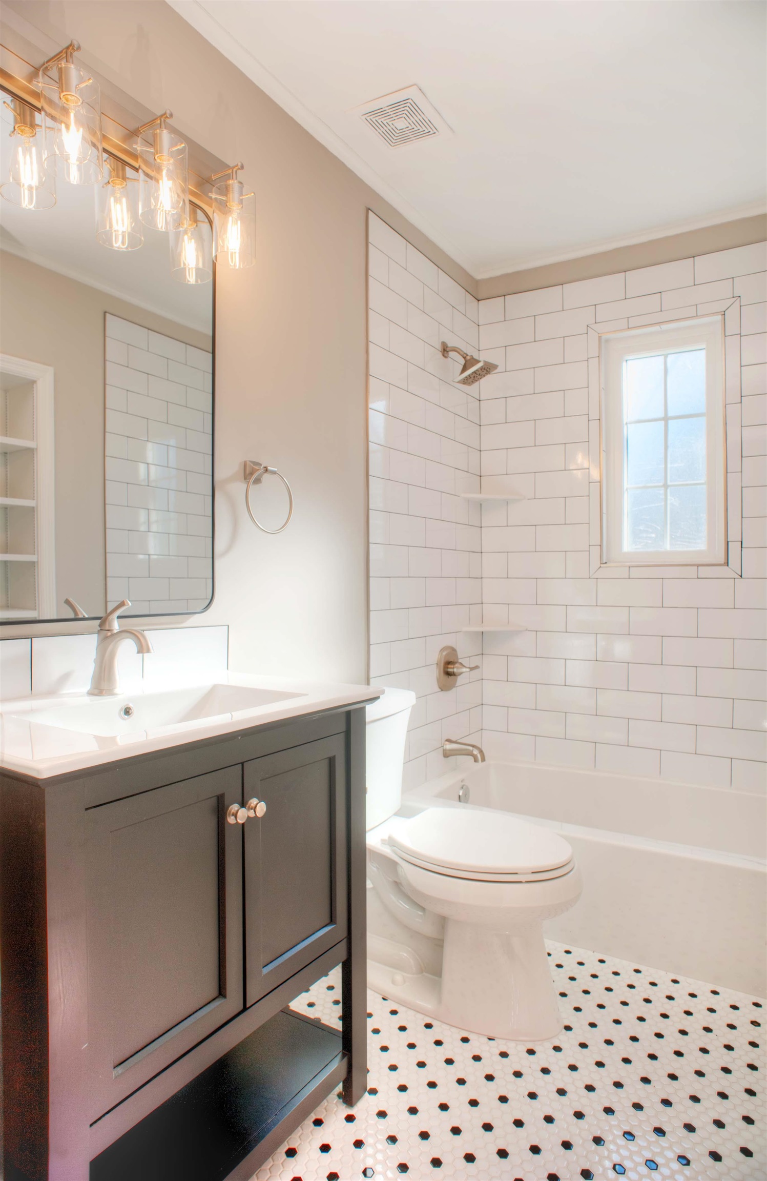 3795 Gamewell Road Memphis, TN 38111 - Photo 13 of 20 a bathroom with a sink toilet a mirror and shower