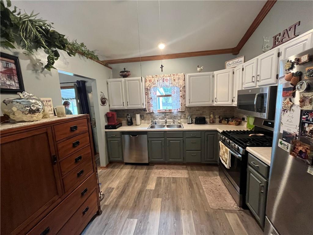 101 Dolphin Drive Butler, PA 16002 - Photo 11 of 27 a kitchen with stainless steel appliances kitchen island granite countertop a stove a sink dishwasher and a refrigerator