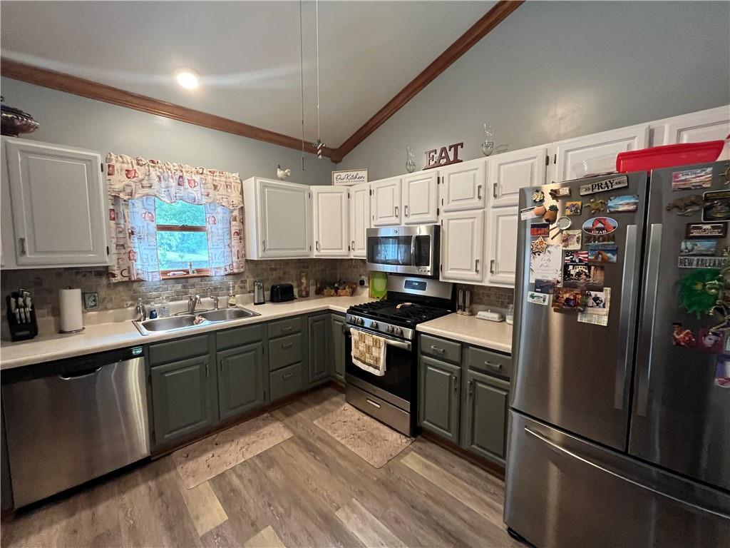 101 Dolphin Drive Butler, PA 16002 - Photo 13 of 27 a kitchen with stainless steel appliances white cabinets a sink and a refrigerator
