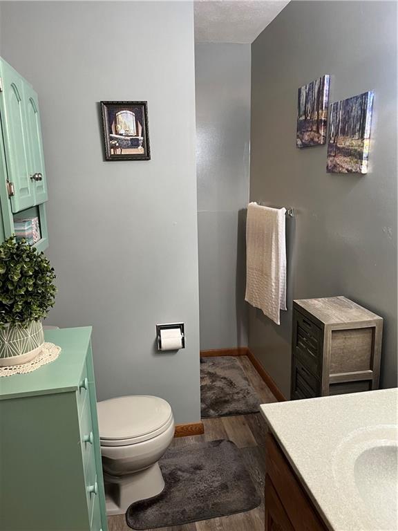 101 Dolphin Drive Butler, PA 16002 - Photo 21 of 27 a bathroom with a toilet a sink and mirror