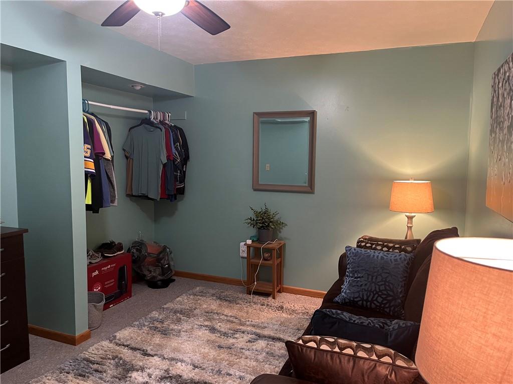 101 Dolphin Drive Butler, PA 16002 - Photo 22 of 27 a bedroom with a bed and a lamp