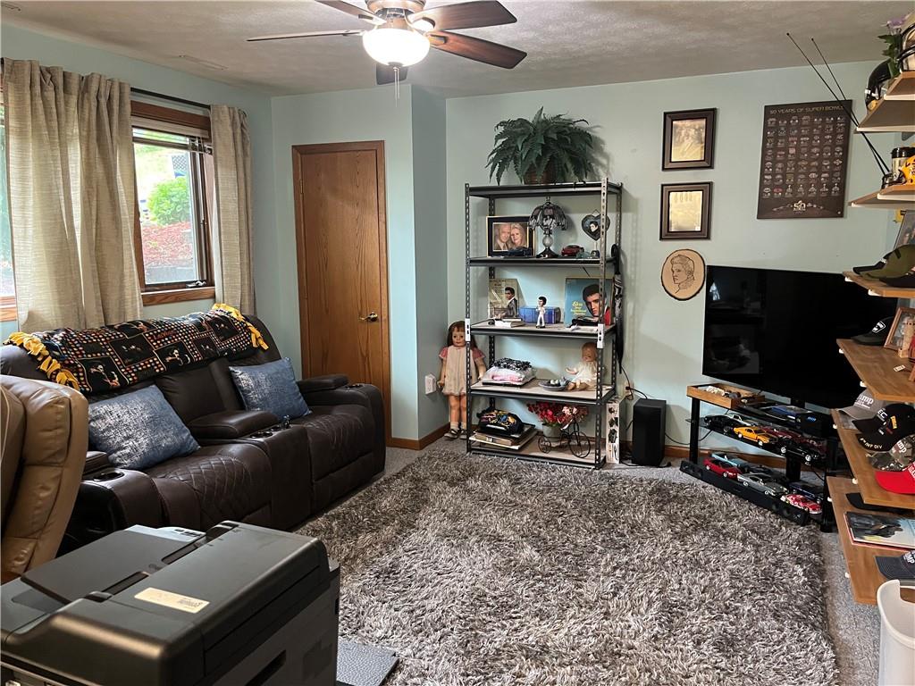 101 Dolphin Drive Butler, PA 16002 - Photo 24 of 27 a living room with furniture a piano and a window