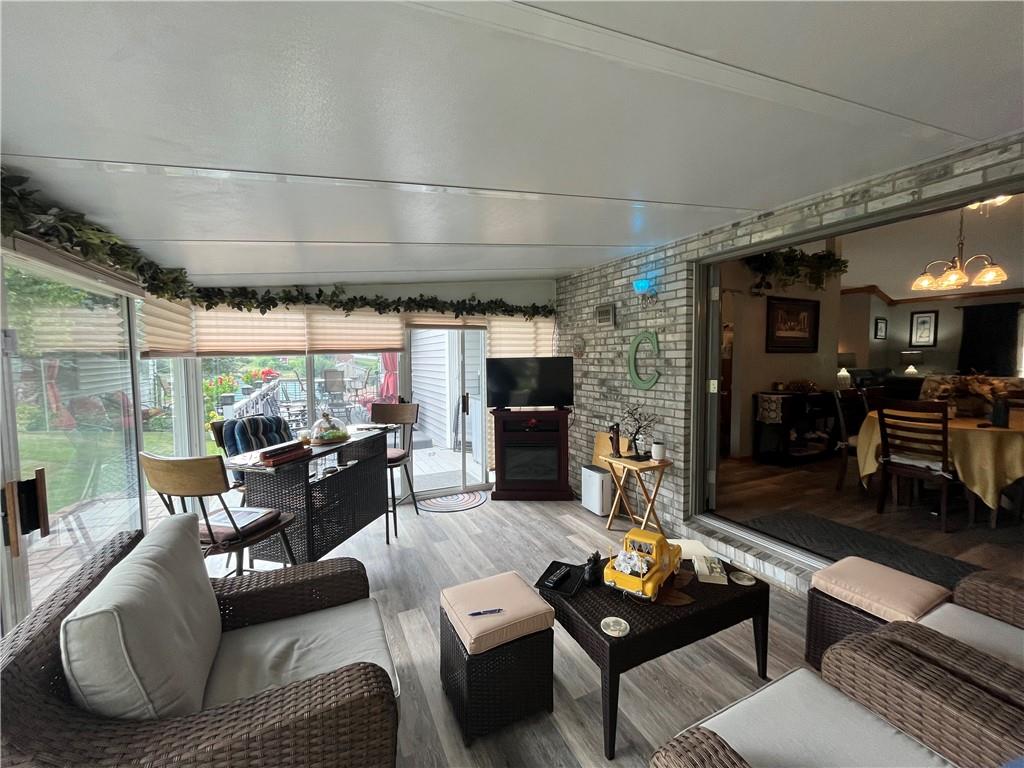 101 Dolphin Drive Butler, PA 16002 - Photo 26 of 27 a living room with furniture and a fireplace