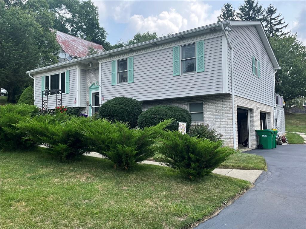 101 Dolphin Drive Butler, PA 16002 - Photo 3 of 27 a view of a house with a yard and plants
