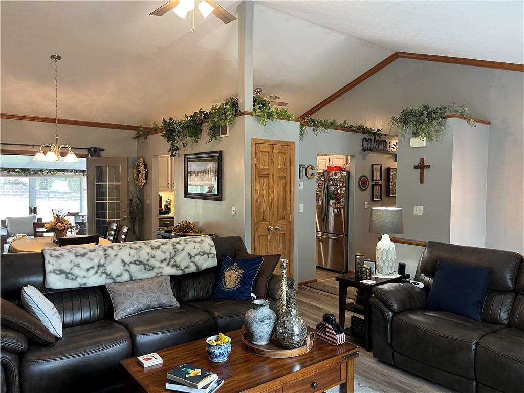 101 Dolphin Drive Butler, PA 16002 - Photo 7 of 27 a living room with furniture and a chandelier