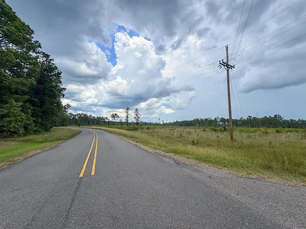 a view of a lake with a big yard