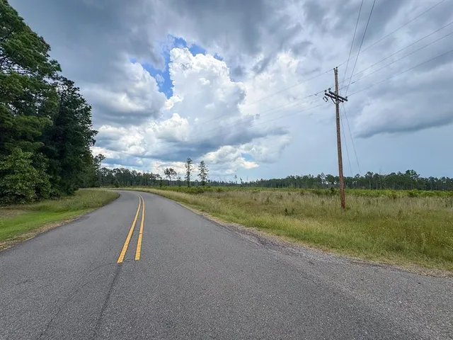 a view of a lake with a big yard