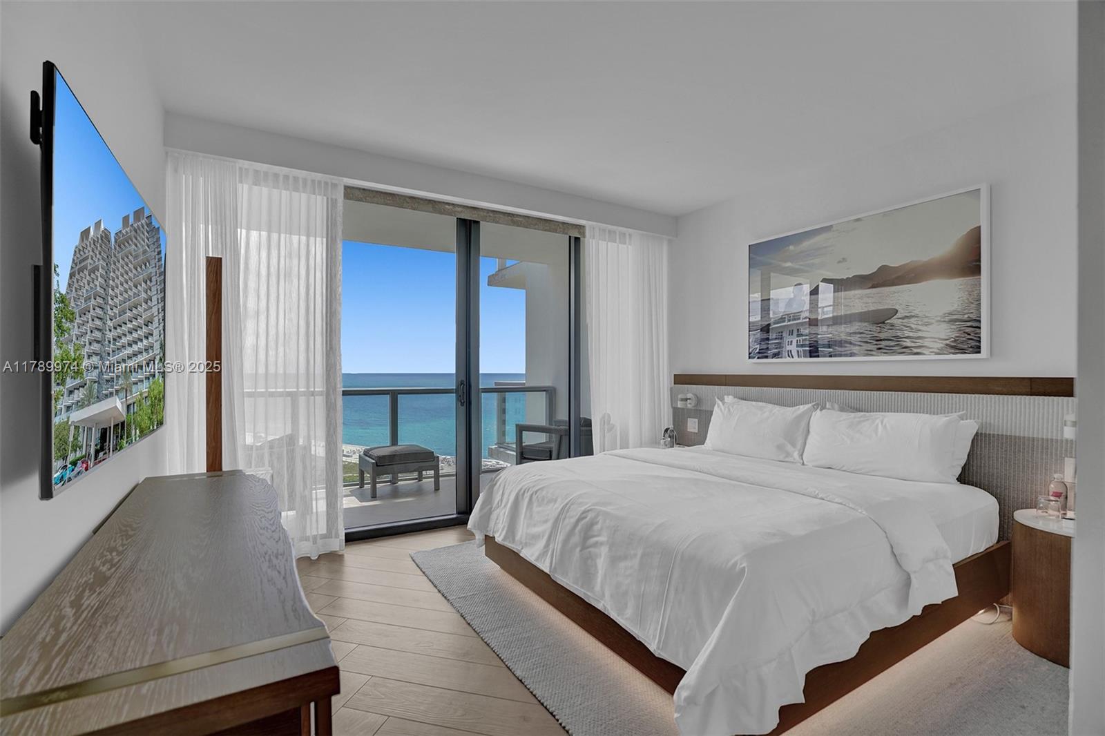 2201 Collins Avenue, Unit 1215 Miami Beach, FL 33139 - Photo 5 of 15 a bedroom with a bed and a large window