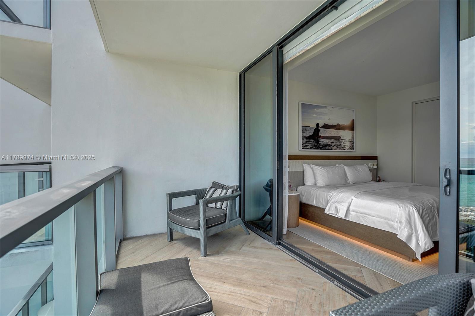 2201 Collins Avenue, Unit 1215 Miami Beach, FL 33139 - Photo 7 of 15 a bedroom with a bed and a cabinets