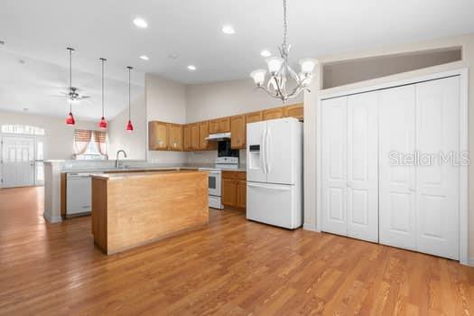28 Karat Path Palm Coast, FL 32164 - Photo 13 of 75 a kitchen with kitchen island white cabinets and stainless steel appliances