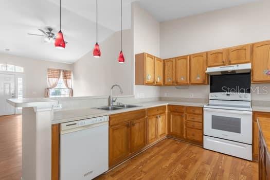 28 Karat Path Palm Coast, FL 32164 - Photo 14 of 75 a kitchen with granite countertop a sink dishwasher a stove and a refrigerator