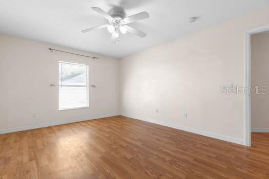 28 Karat Path Palm Coast, FL 32164 - Photo 21 of 75 an empty room with wooden floor and windows