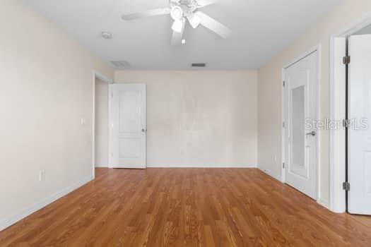 28 Karat Path Palm Coast, FL 32164 - Photo 22 of 75 an empty room with wooden floor fan and windows