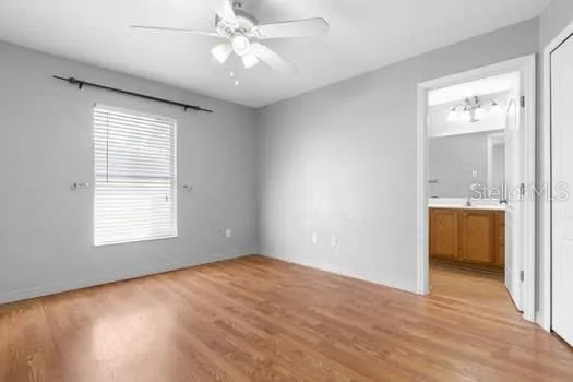 a large kitchen with cabinets and stainless steel appliances
