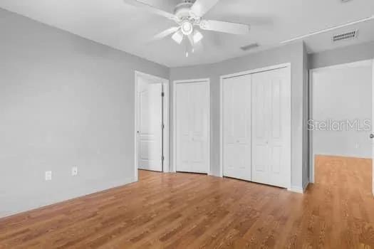 a large kitchen with stainless steel appliances granite countertop a sink and cabinets