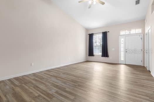28 Karat Path Palm Coast, FL 32164 - Photo 38 of 75 a view of an empty room with wooden floor and a window