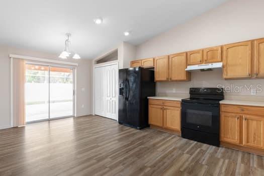 28 Karat Path Palm Coast, FL 32164 - Photo 44 of 75 a kitchen with granite countertop a refrigerator stove top oven and sink