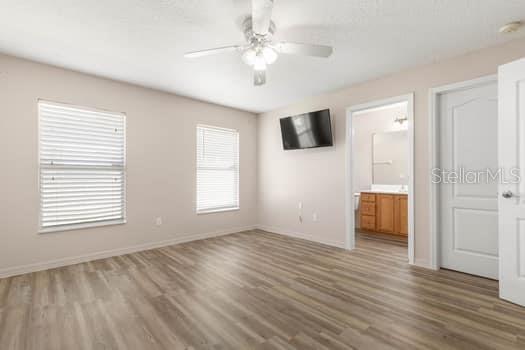 28 Karat Path Palm Coast, FL 32164 - Photo 49 of 75 a view of an empty room with window and wooden floor