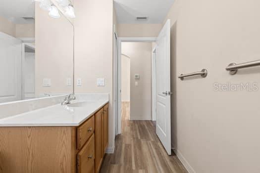 28 Karat Path Palm Coast, FL 32164 - Photo 56 of 75 a bathroom with a granite countertop sink a mirror and a bathtub