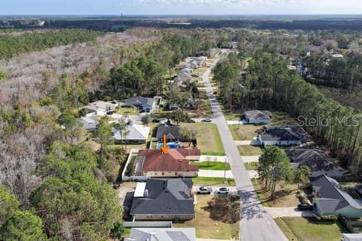 28 Karat Path Palm Coast, FL 32164 - Photo 71 of 75 an aerial view of a house with a lake view