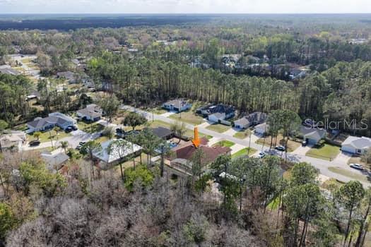 28 Karat Path Palm Coast, FL 32164 - Photo 72 of 75 an aerial view of a house with a yard and lake view