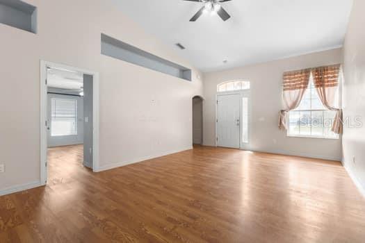 28 Karat Path Palm Coast, FL 32164 - Photo 9 of 75 a view of an empty room with a window and wooden floor