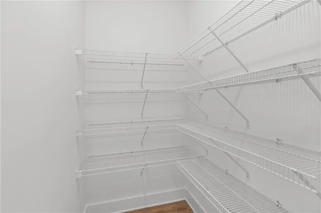 a kitchen with stainless steel appliances a sink stove and cabinets