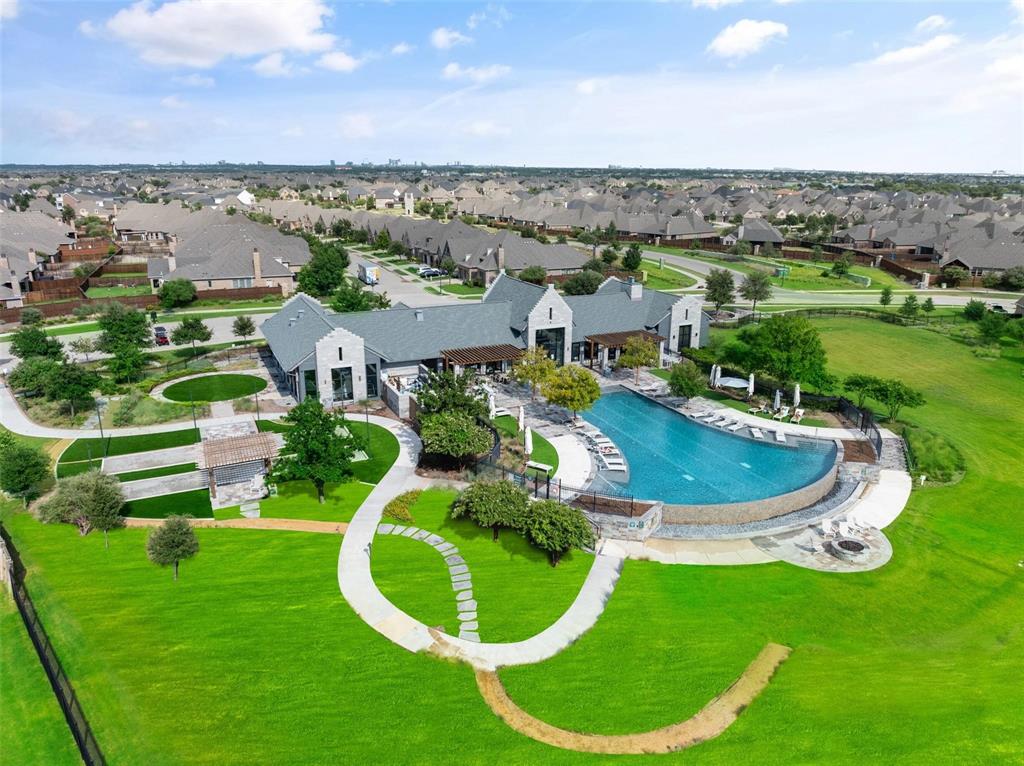 7821 Kentmere The Colony, TX 75056 - Photo 32 of 40 Exclusive to Waterford Point residents, this private lakeside clubhouse overlooks beautiful Lake Lewisville and offers an unmatched collection of luxury amenities, including a resort-style pool and spa, outdoor grilling and gathering areas, pickleball, a fitness center, full catering kitchen, and elegant event spaces. Residents also enjoy a dedicated on-site lifestyle coordinator, in addition to full access to all of The Tribute's award-winning amenities, creating an exceptional resort-style living experience.