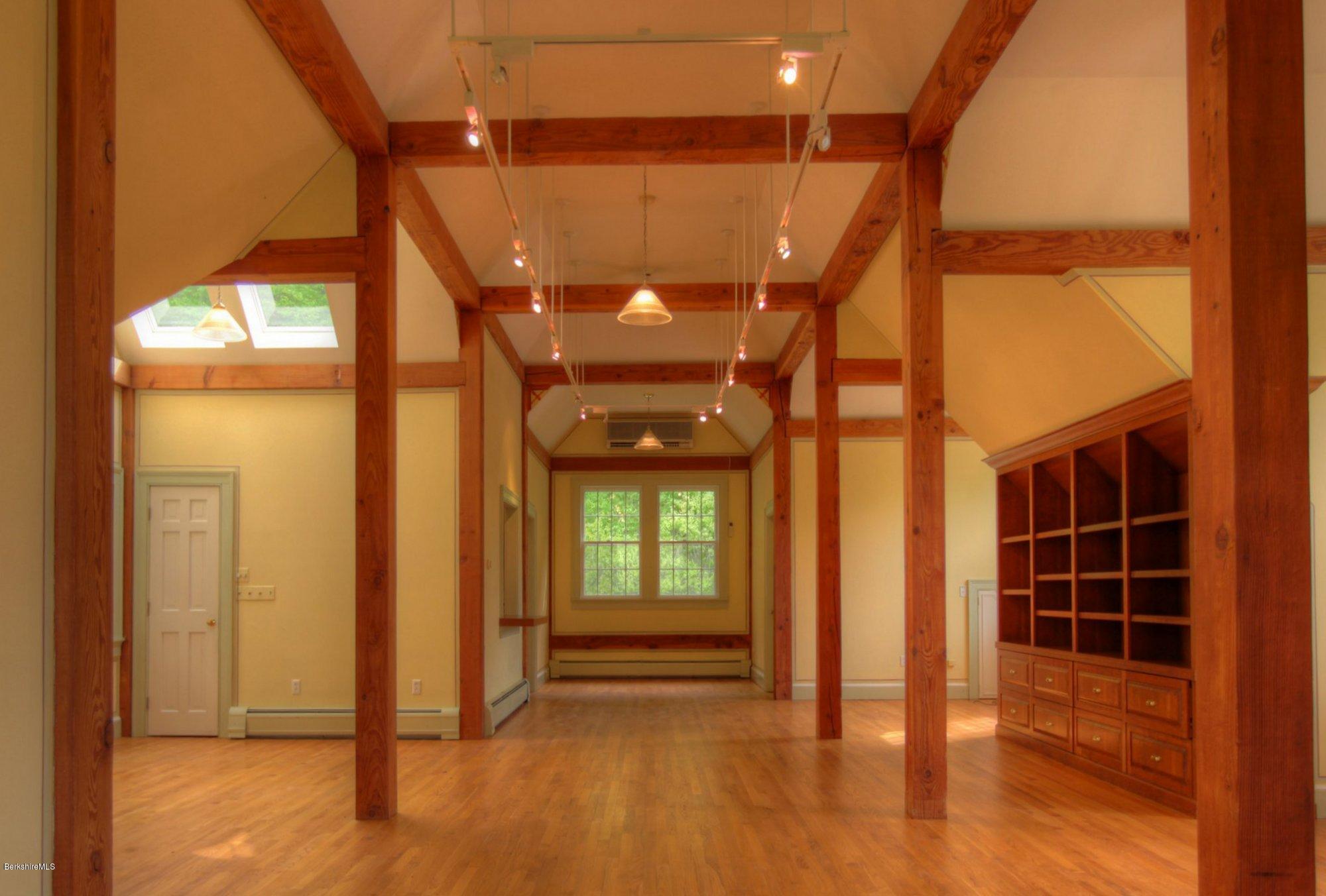 130 Jerusalem Road Tyringham, MA 01264 - Photo 5 of 15 a view of empty room with wooden floor and fan