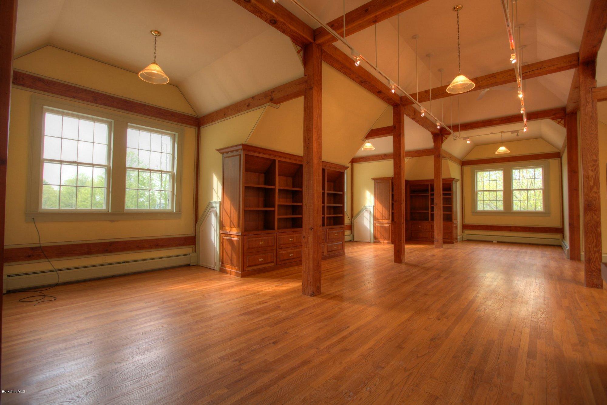 130 Jerusalem Road Tyringham, MA 01264 - Photo 6 of 15 a view of an empty room with wooden floor and a window