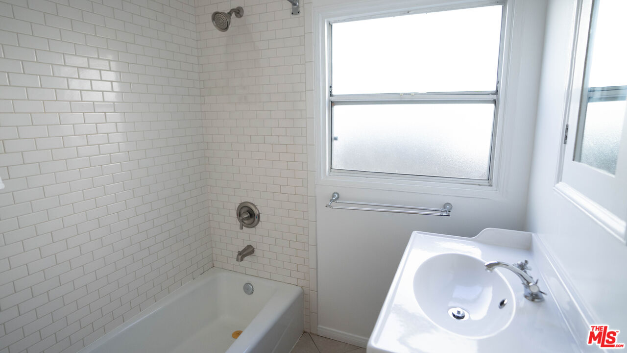 3411 Larga Avenue Los Angeles, CA 90039 - Photo 11 of 26 a bathroom with a tub a sink and a window